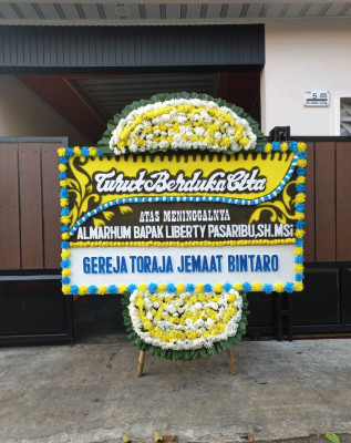 Papan Bunga Duka di Airgaram